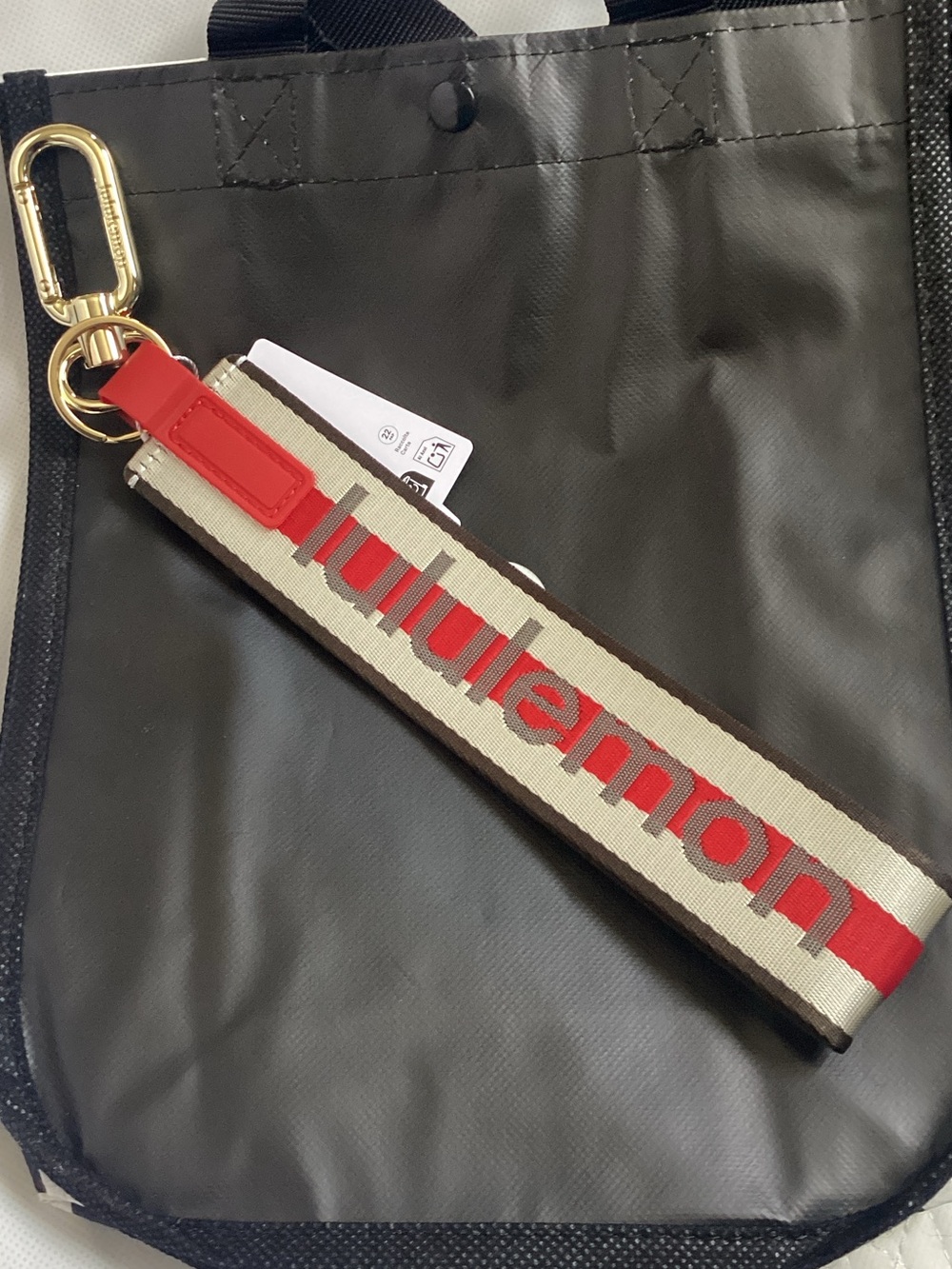 Lululemon Never lost keychain